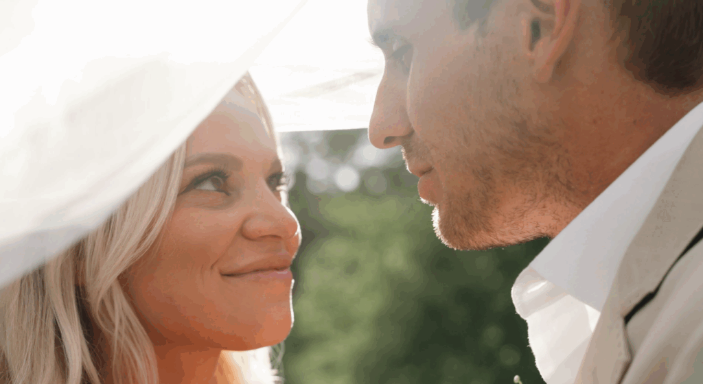 bride and groom posing for their Colorado wedding videographer