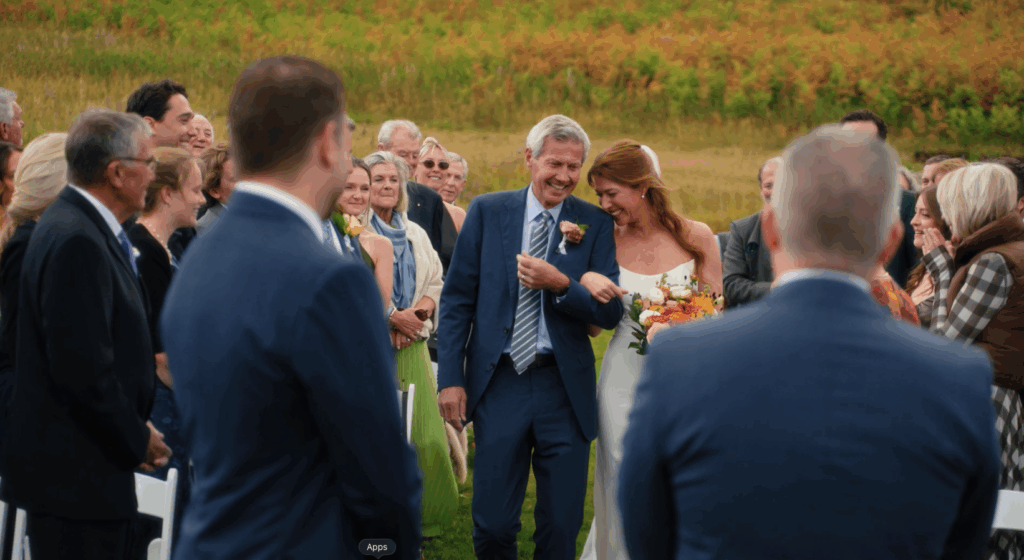 bride and dad walking down the aisle at their Colorado mountain wedding