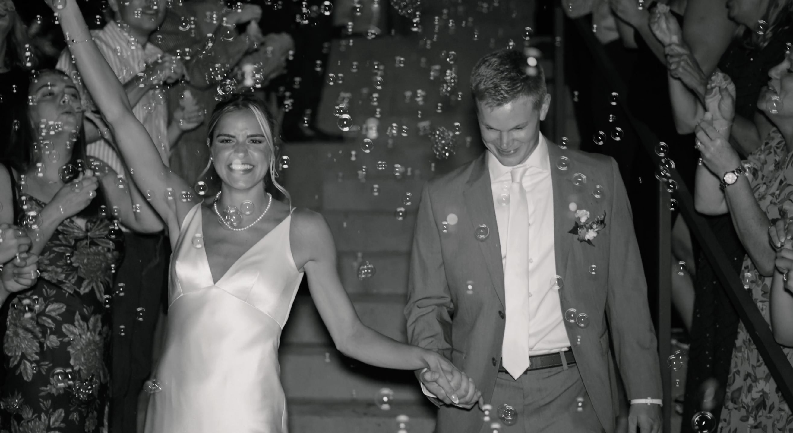 vail wedding videographer films couple during grand exit