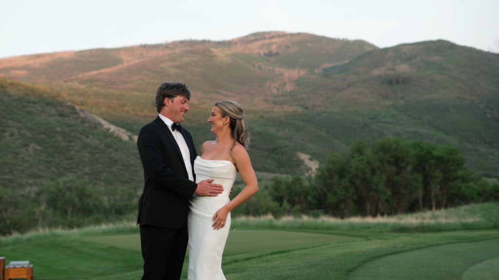 couple posing for eagle colorado wedding videographer